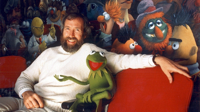 Jim Henson and his creation, Kermit the Frog, sit in front of a mural by Coulter Watt. Jim Henson and his creation, Kermit the Frog, sit in front of a mural by Coulter Watt.